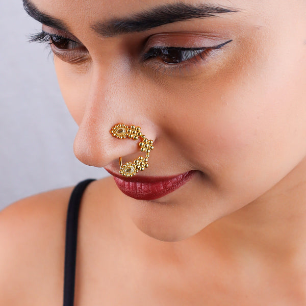 Close-up of woman's eye with Nath jewelry