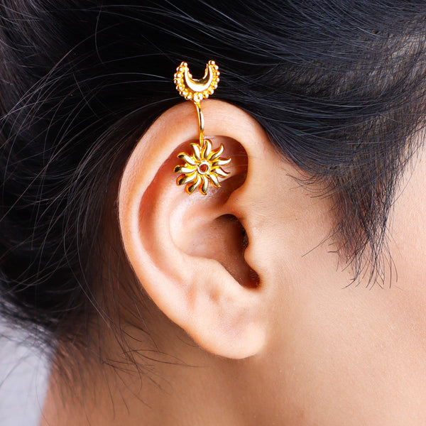 Close-up of gold moon earrings on white background