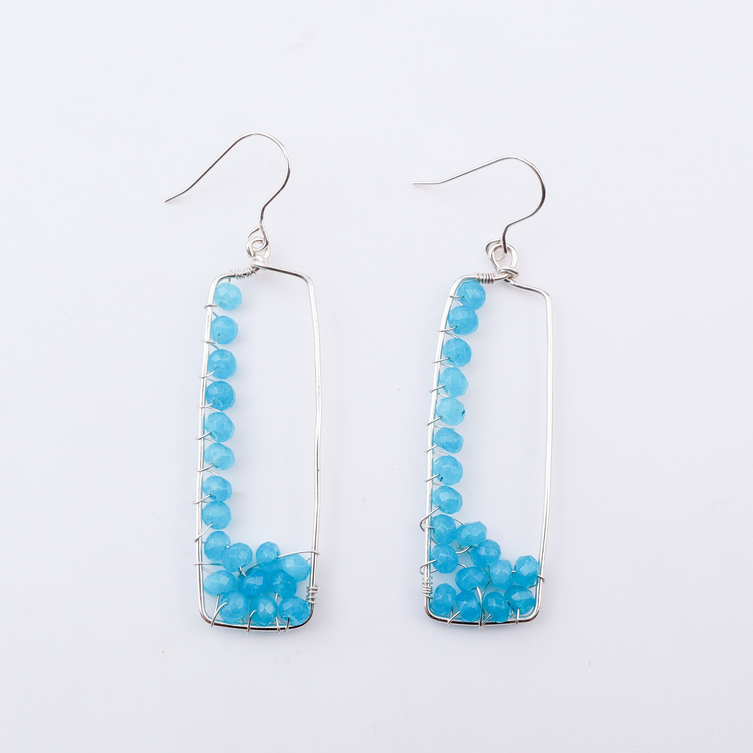 Blue arc earrings with sterling silver wire and blue beads