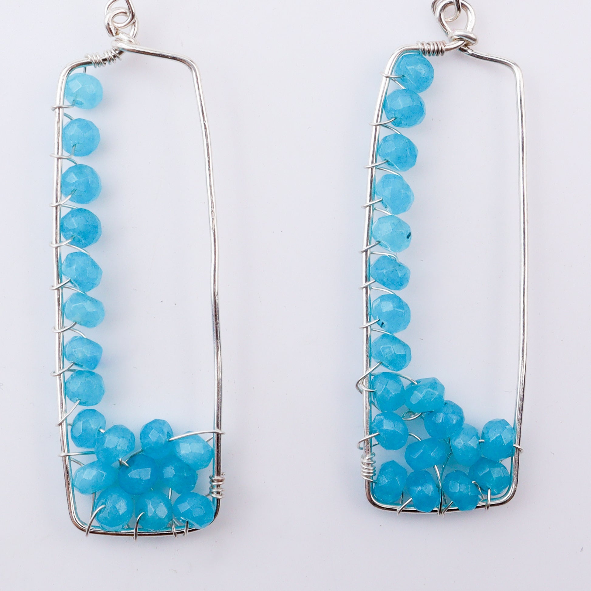 Silver frame blue bead earrings for women