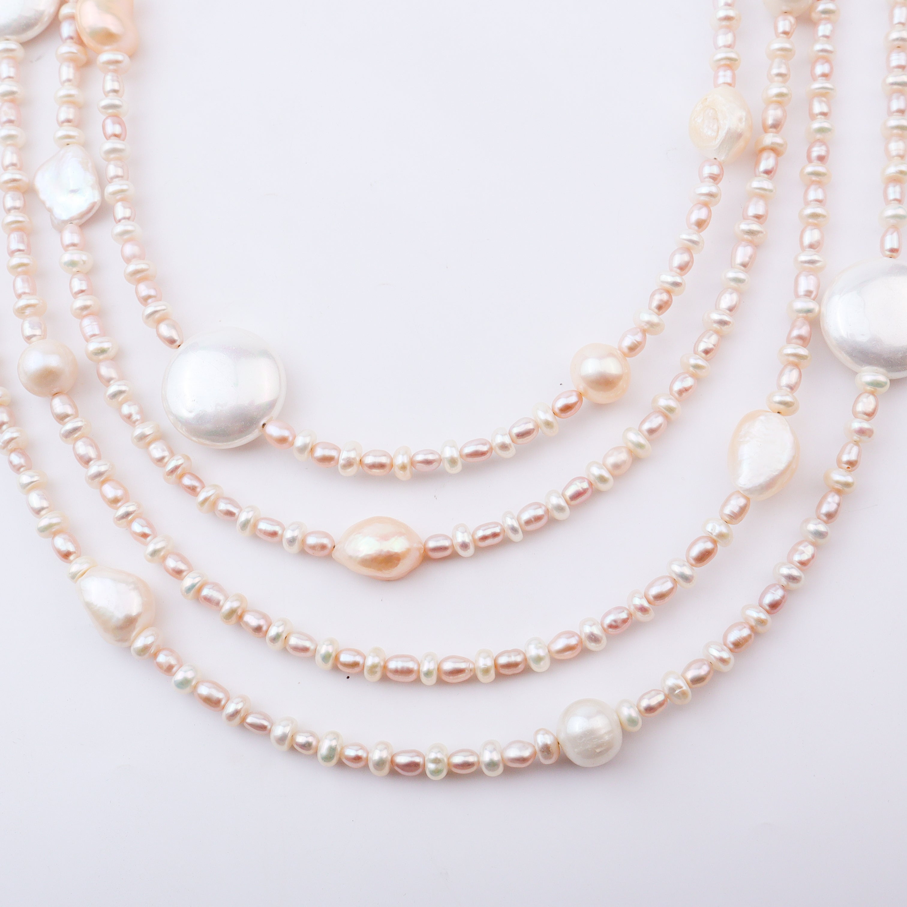 Pearl necklace with large pearl pendant on white background