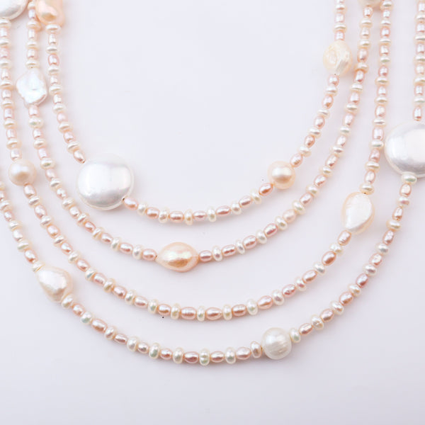 Pearl necklace with large pearl pendant on white background