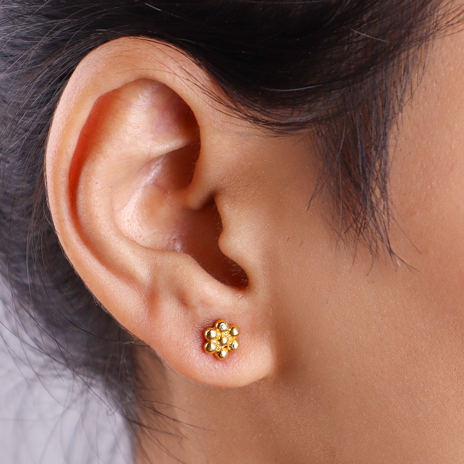 Close-up of gold earrings
