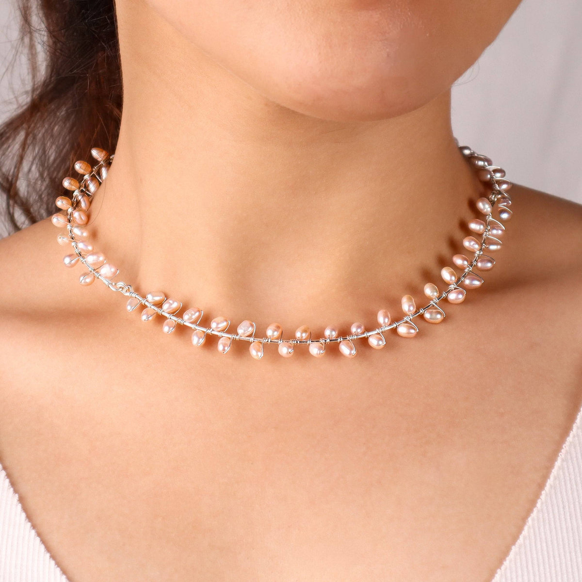 Close-up of fresh water pearl choker highlighting lustrous natural pearls and secure silver clasp