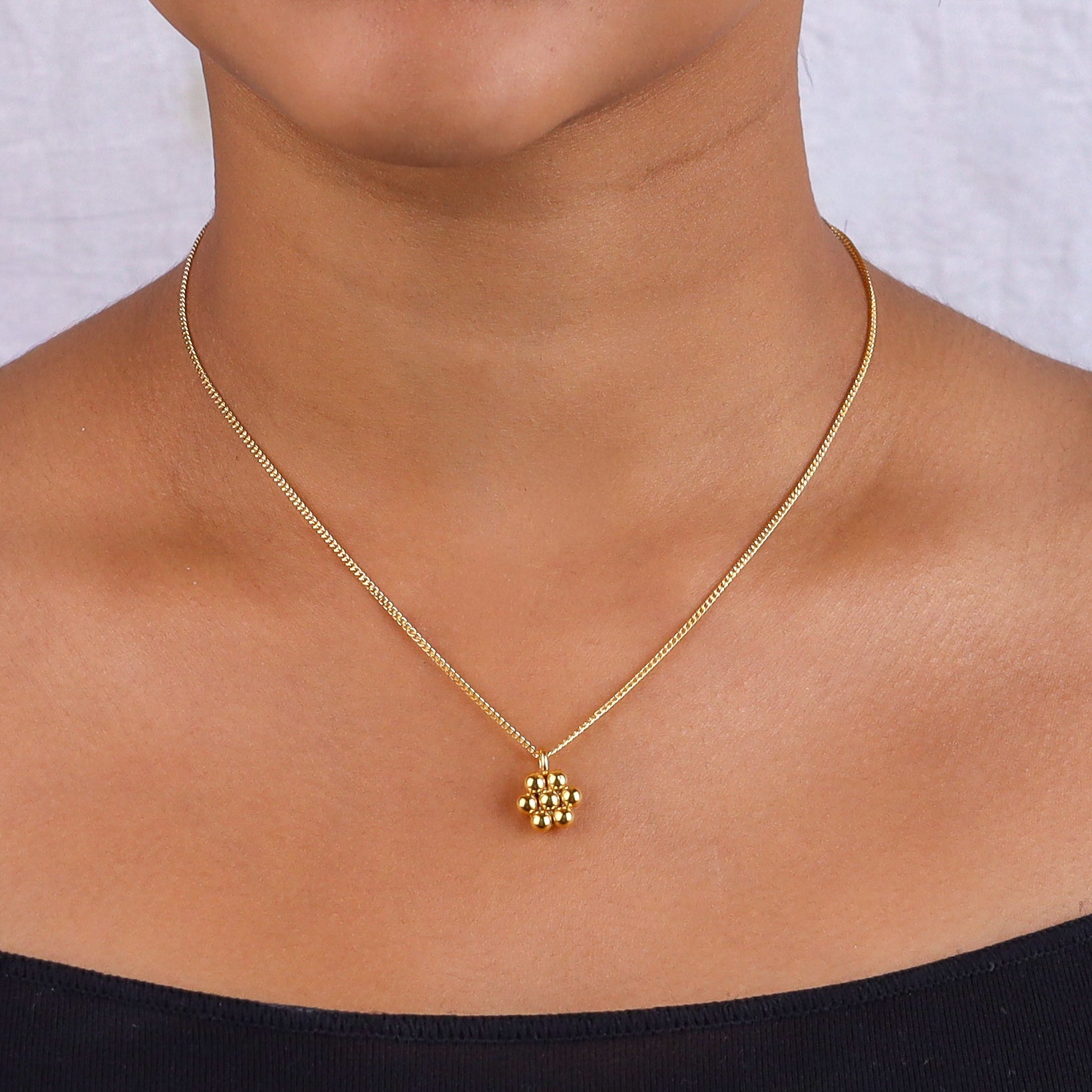 Gold chain necklace on model