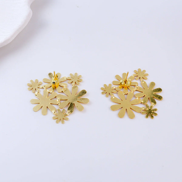 Angled view of Brass Fashion Earrings highlighting the unique silhouette, structure, and polished brass finish