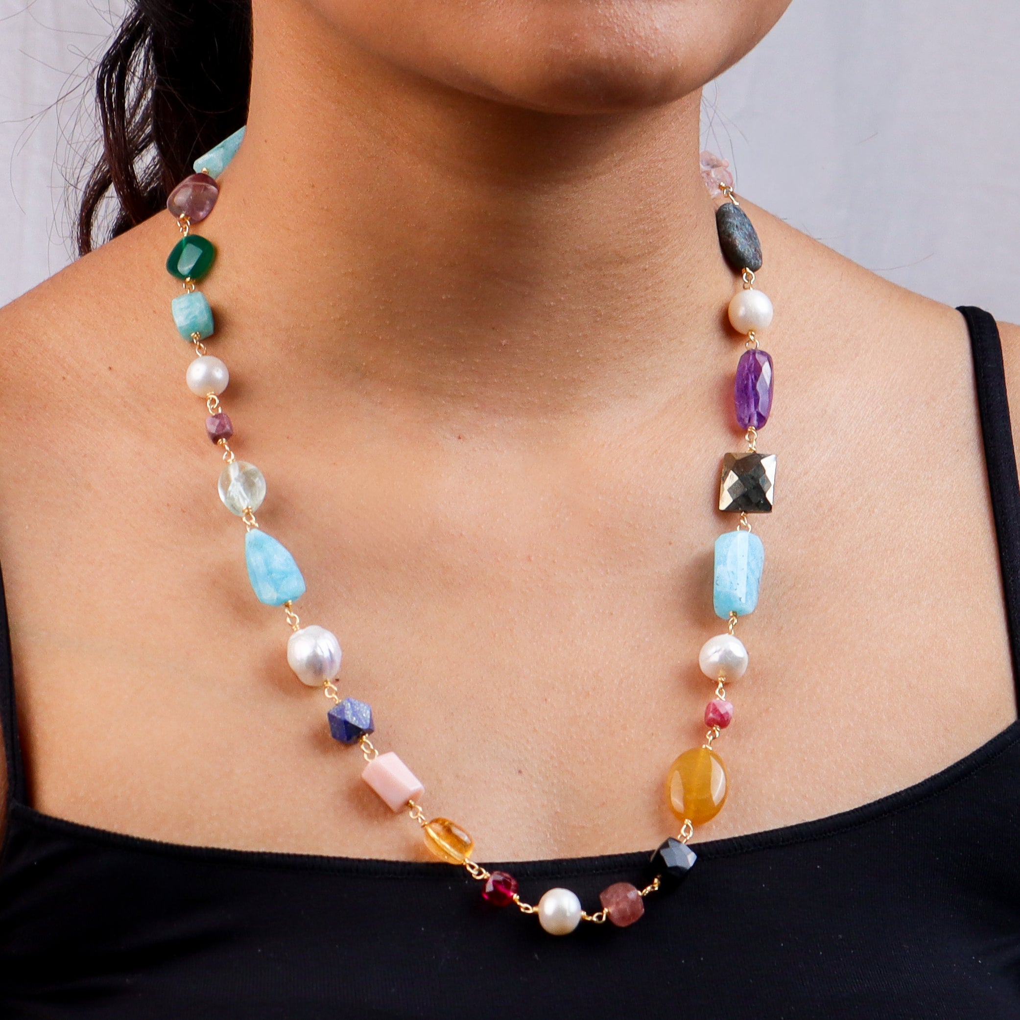 Necklace with multicolored stones on model