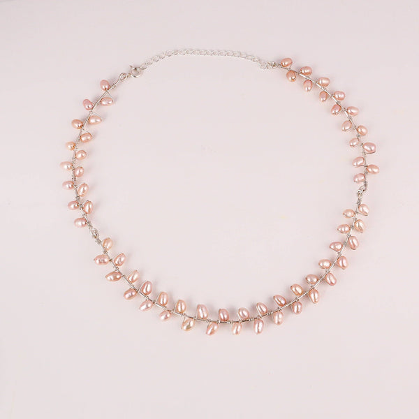 Angled side view of fresh water pearl choker necklace showing smooth pearl alignment and shine