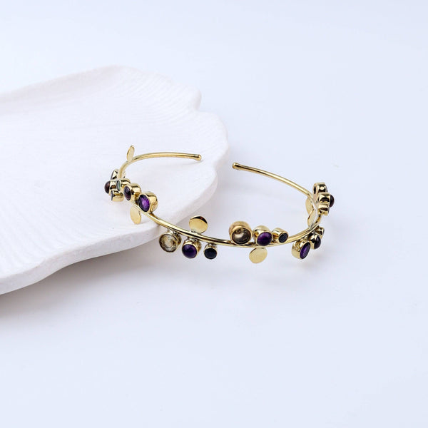 Close-up of a brass fashion bracelet showcasing intricate detailing, textured elements, and fine craftsmanship