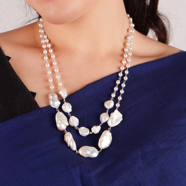 Close-up of two layer fresh water pearl necklace highlighting lustrous pearls and secure silver clasp