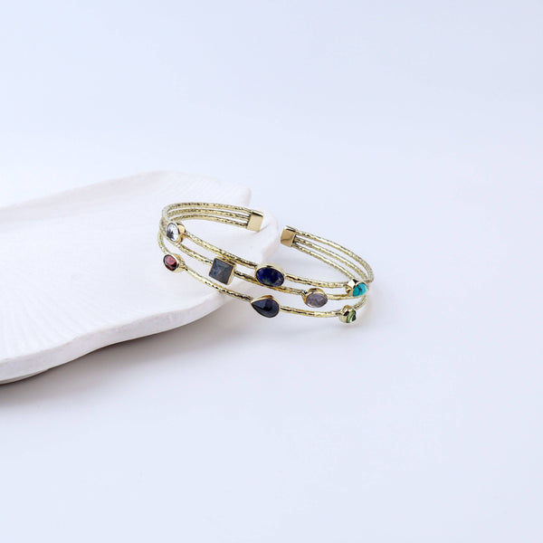 Angled view of the Brass Fashion Bracelet highlighting its unique silhouette, structure, and polished brass finish