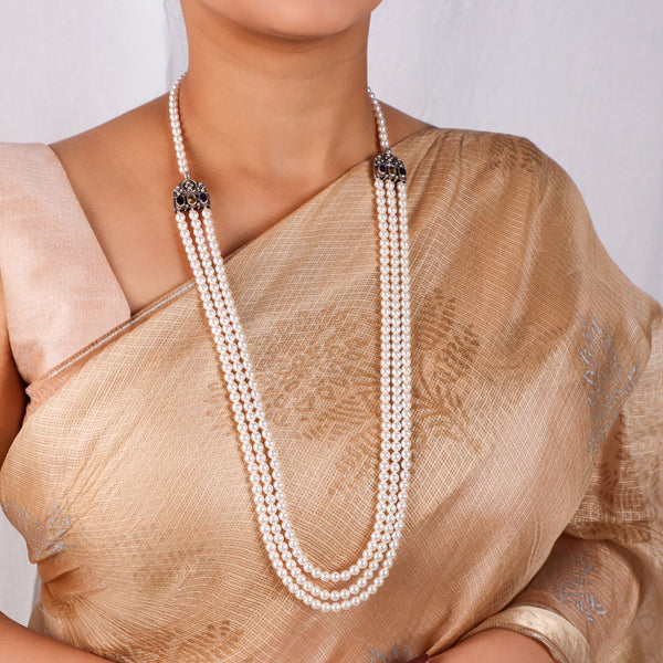 Elegant pearl necklace with layered design and carved findings