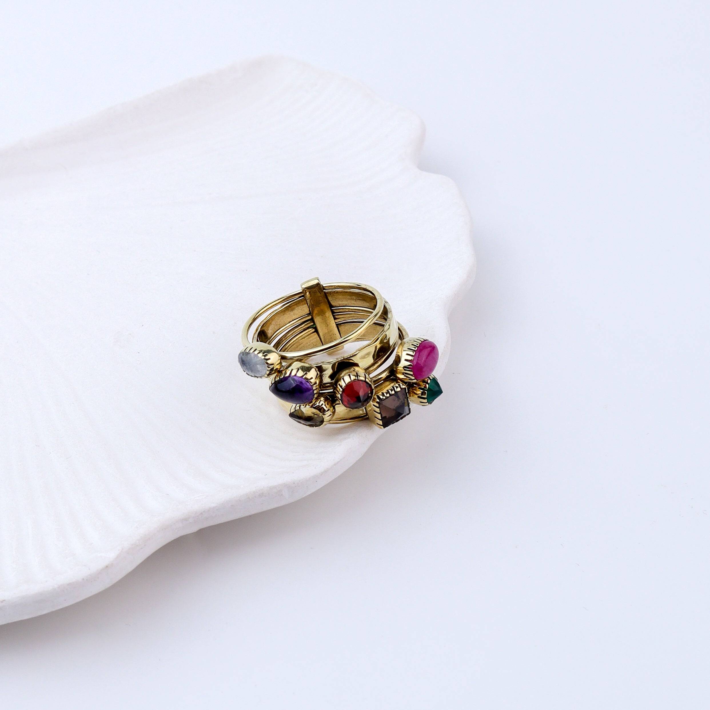 Flat-lay of Brass Fashion Ring with complementary jewellery and accessories for a chic styling setup