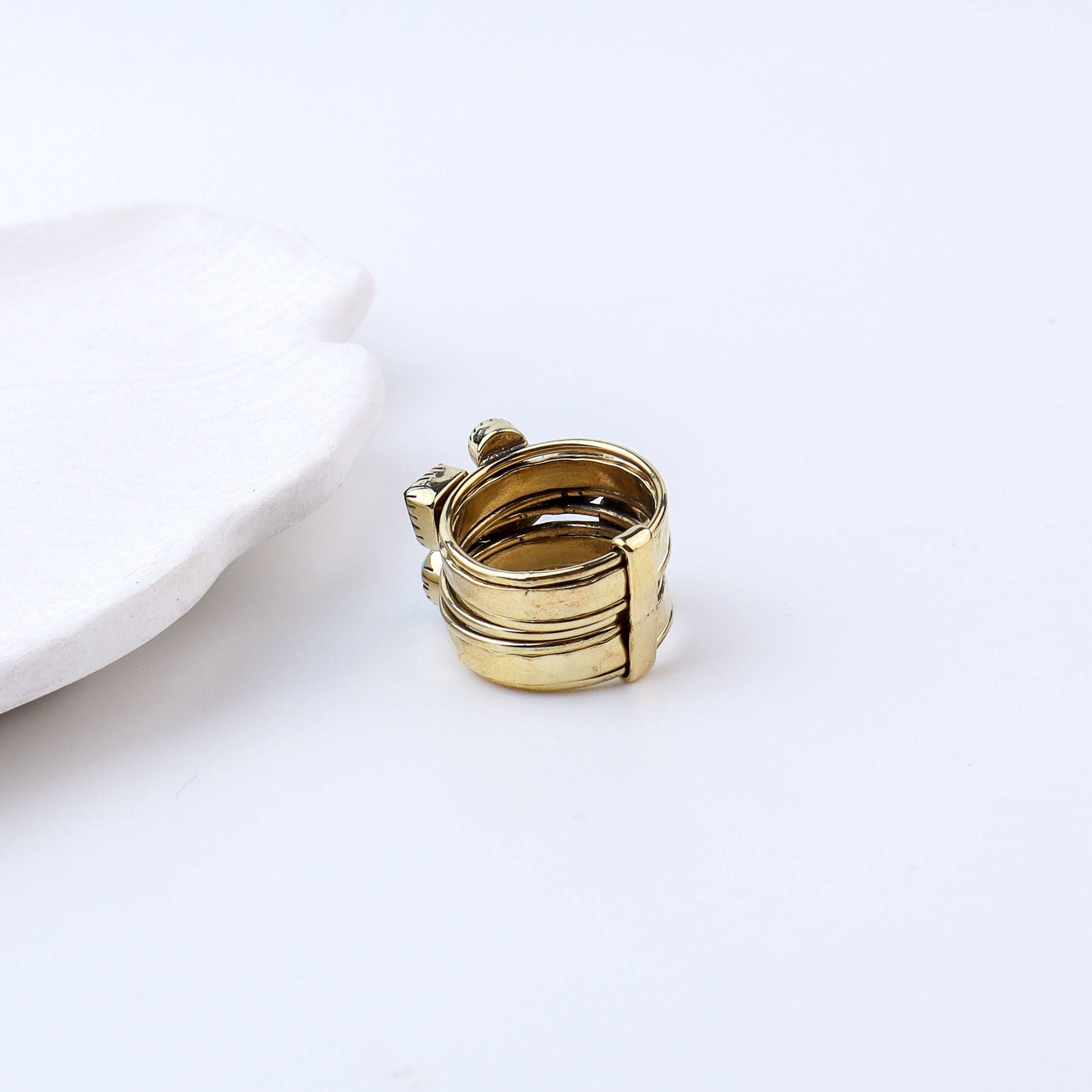 Flat-lay of Brass Fashion Ring with complementary jewellery and accessories for a chic styling setup