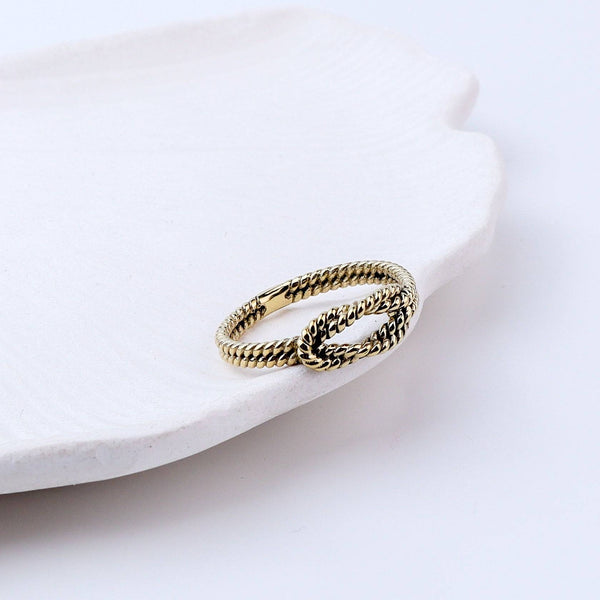 Close-up of a brass fashion ring showcasing intricate detailing, unique design, and fine craftsmanship