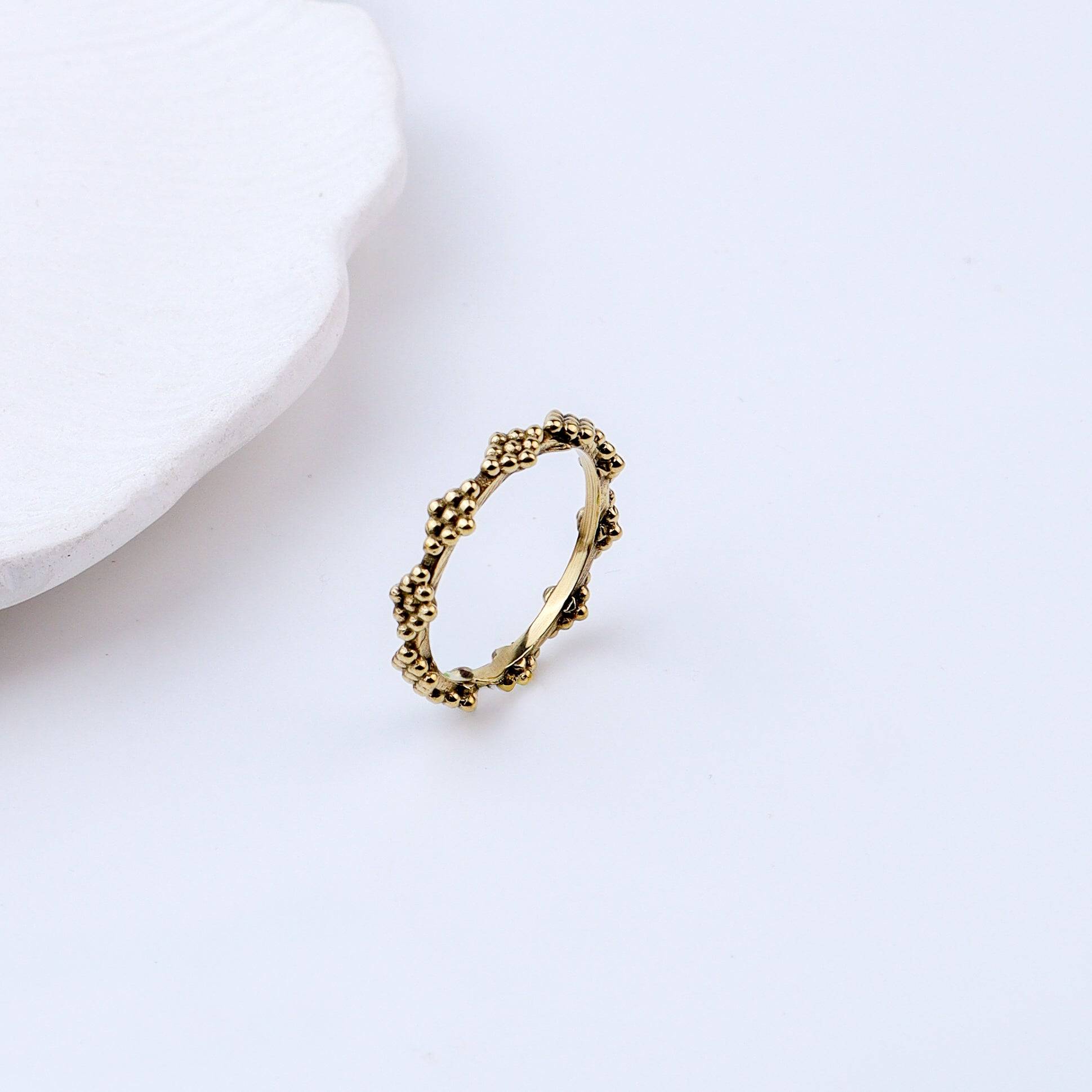 Detailed view of Brass Fashion Ring highlighting intricate motifs, textured surface, and refined brass finish