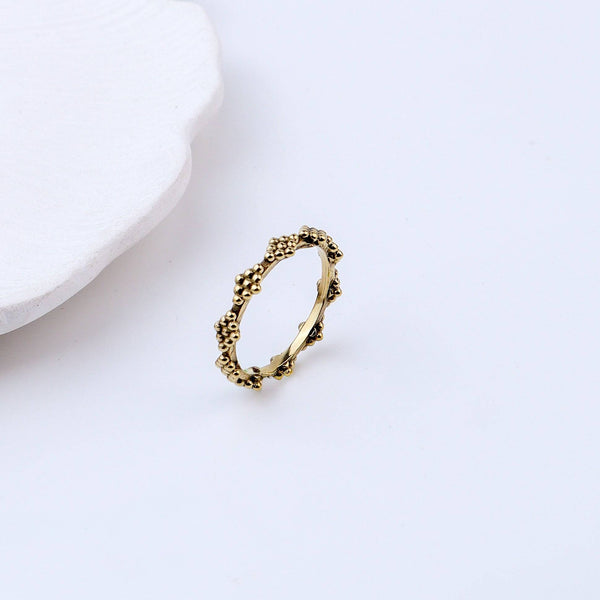 Detailed view of Brass Fashion Ring highlighting intricate motifs, textured surface, and refined brass finish