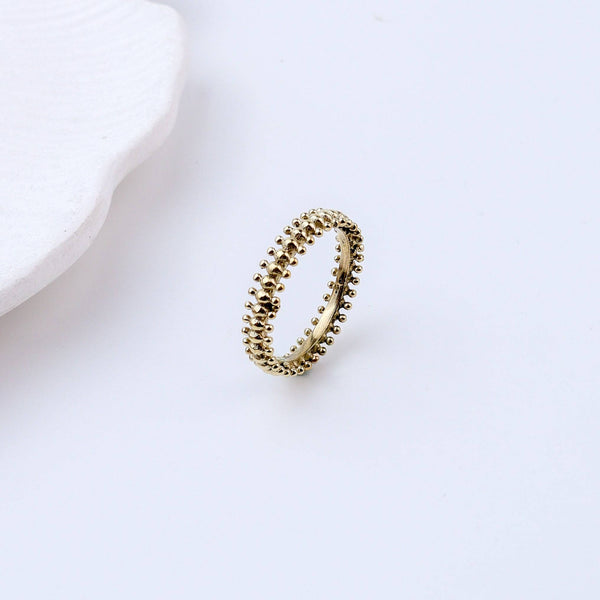 Flat-lay of Brass Fashion Ring with complementary jewellery and accessories for a chic styling setup