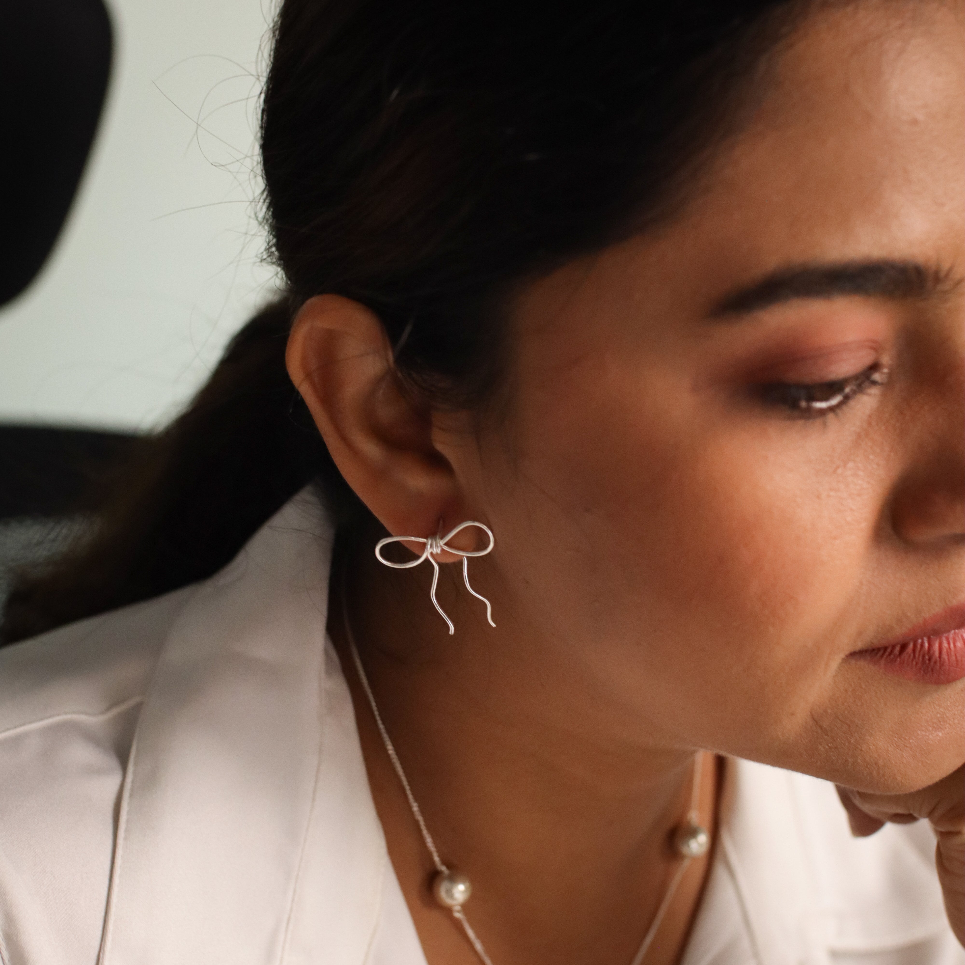 Silver bow earring