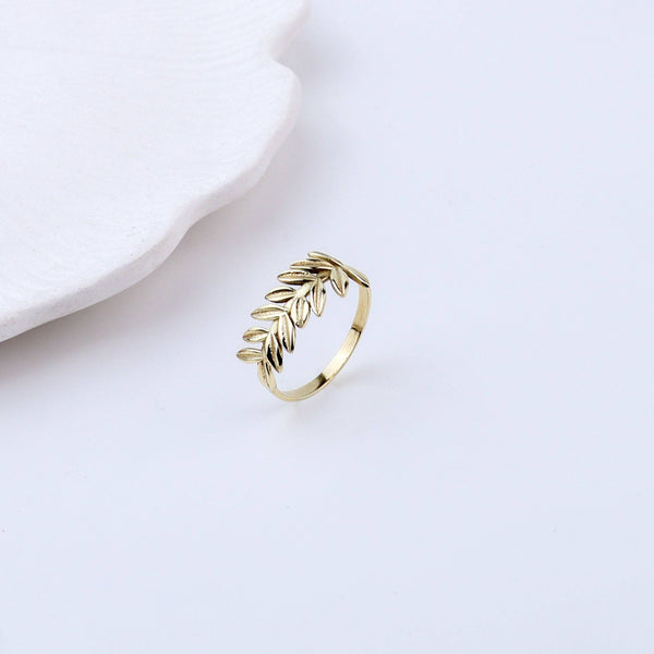 Close-up of a brass fashion ring showcasing intricate detailing, unique design, and fine craftsmanship