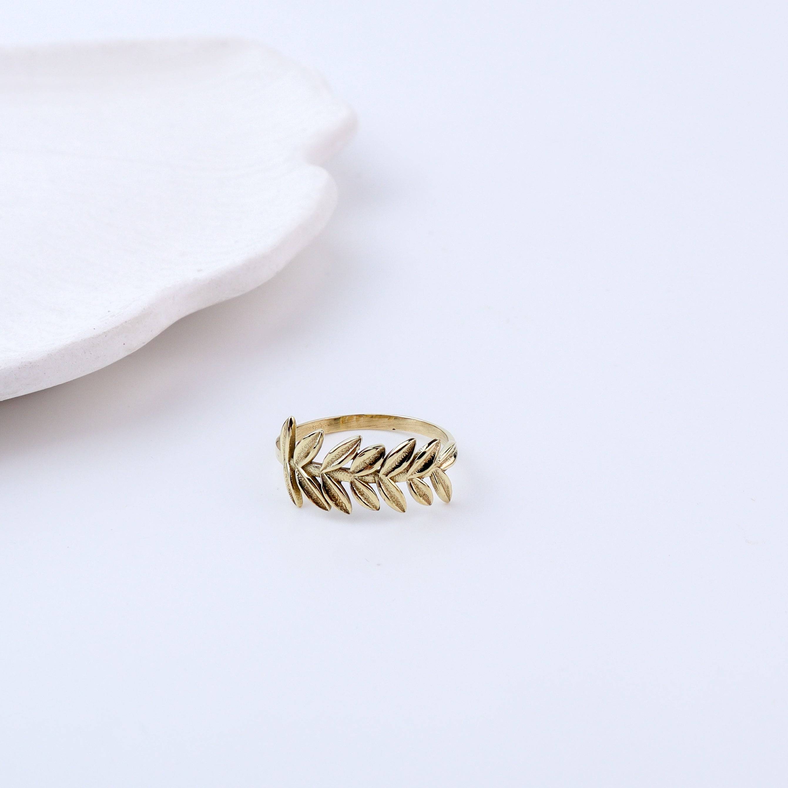 Detailed view of Brass Fashion Ring highlighting intricate motifs, textured surface, and refined brass finish