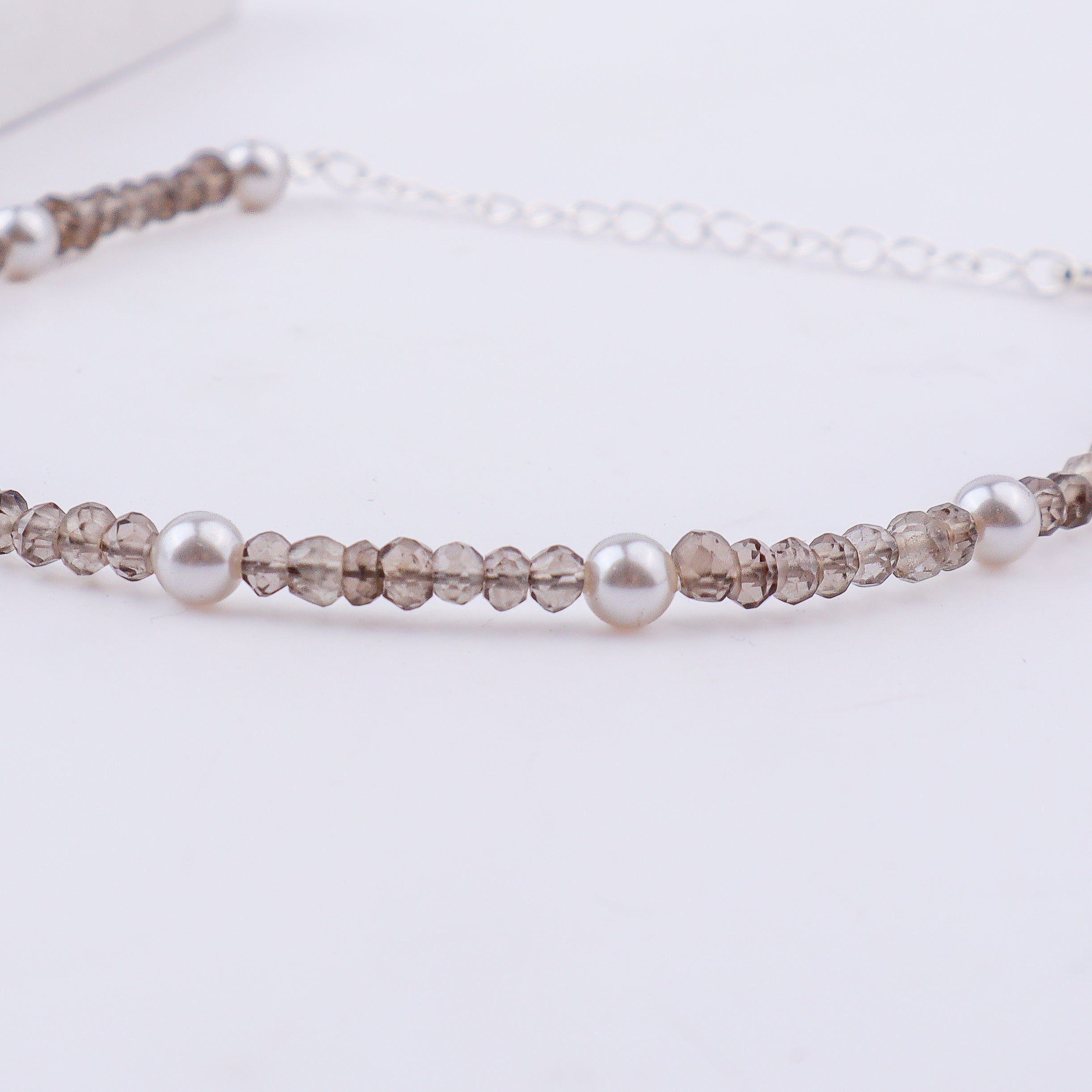 Silver anklet with pearls and faceted beads with clasp detail