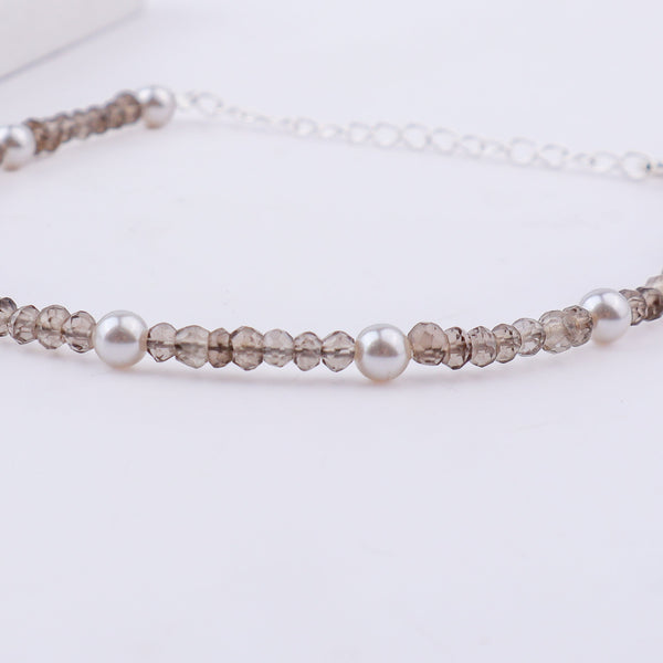 Silver anklet with pearls and faceted beads with clasp detail