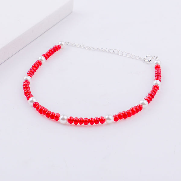 Red and white beaded anklet with silver chain extension