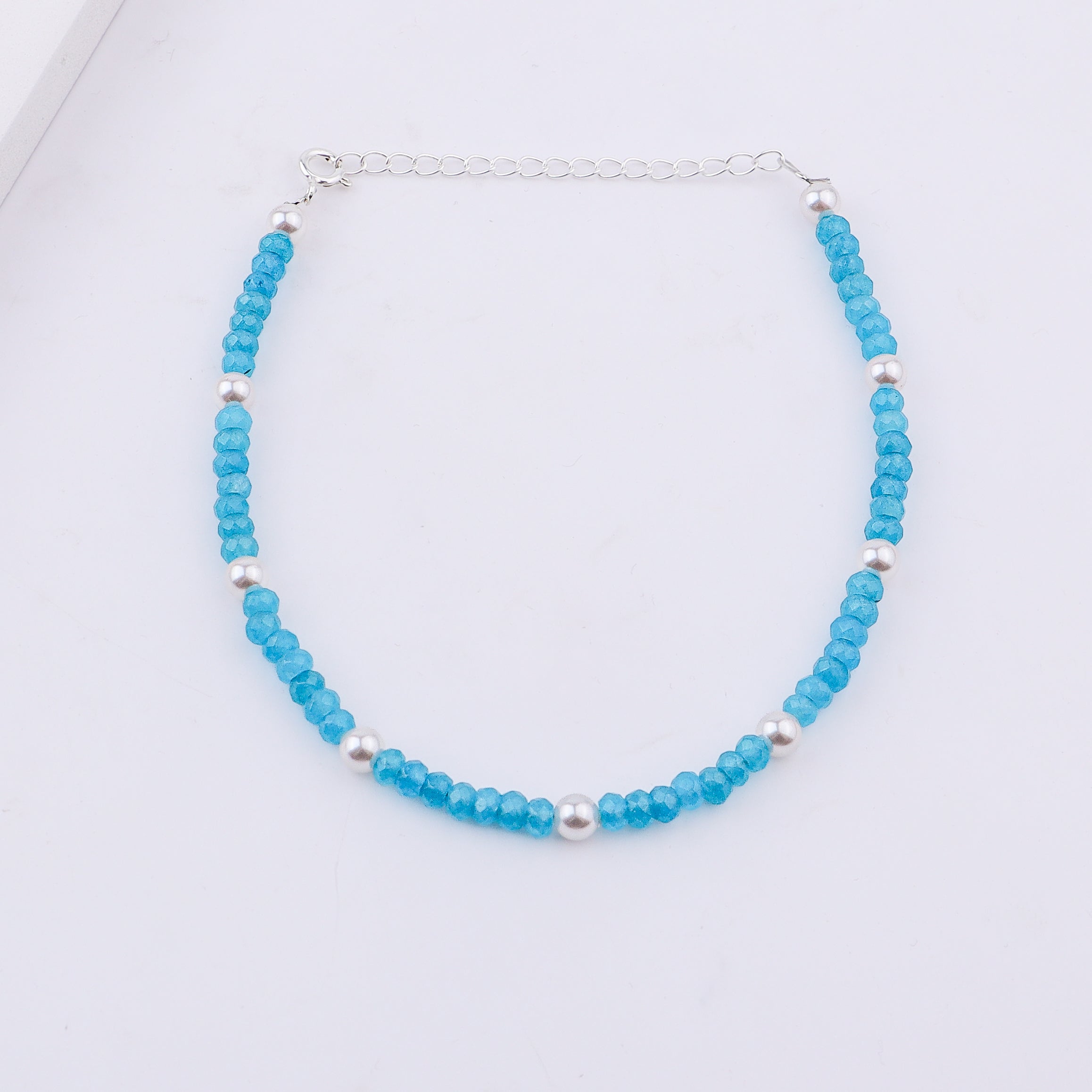 Blue beaded anklet with silver chain detail