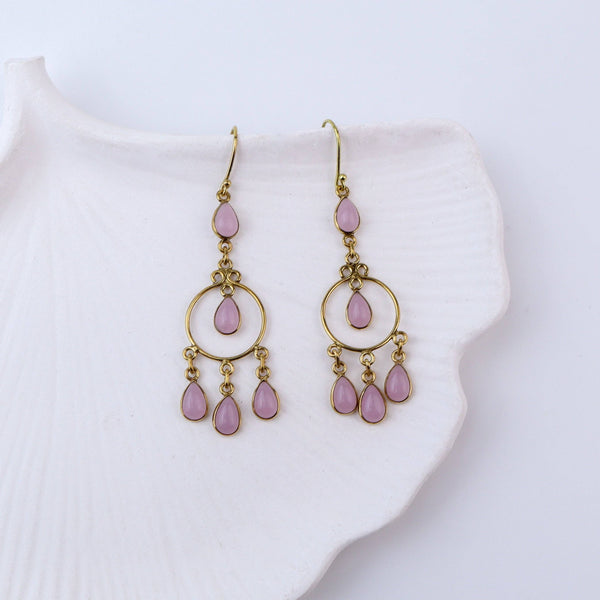 Close-up of brass fashion earrings showcasing intricate detailing, textured elements, and fine craftsmanship
