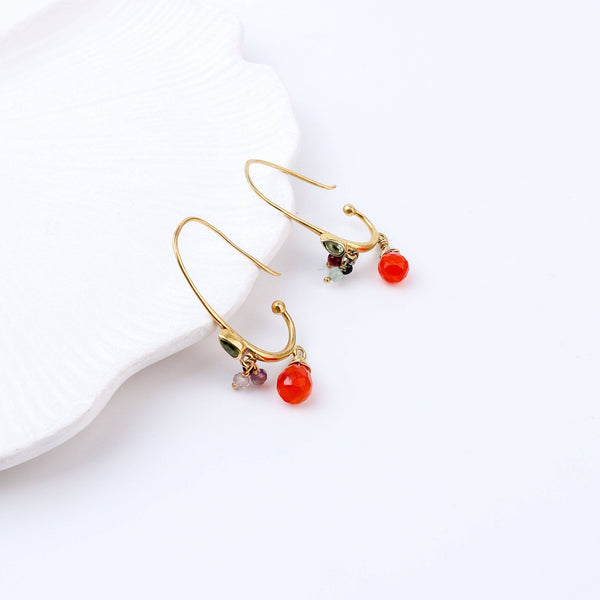 Angled view of Brass Fashion Earrings highlighting the unique silhouette, structure, and polished brass finish