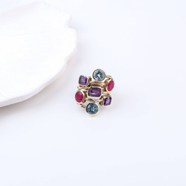 Flat-lay of a brass fashion ring with complementary jewellery and accessories for a chic styling setup