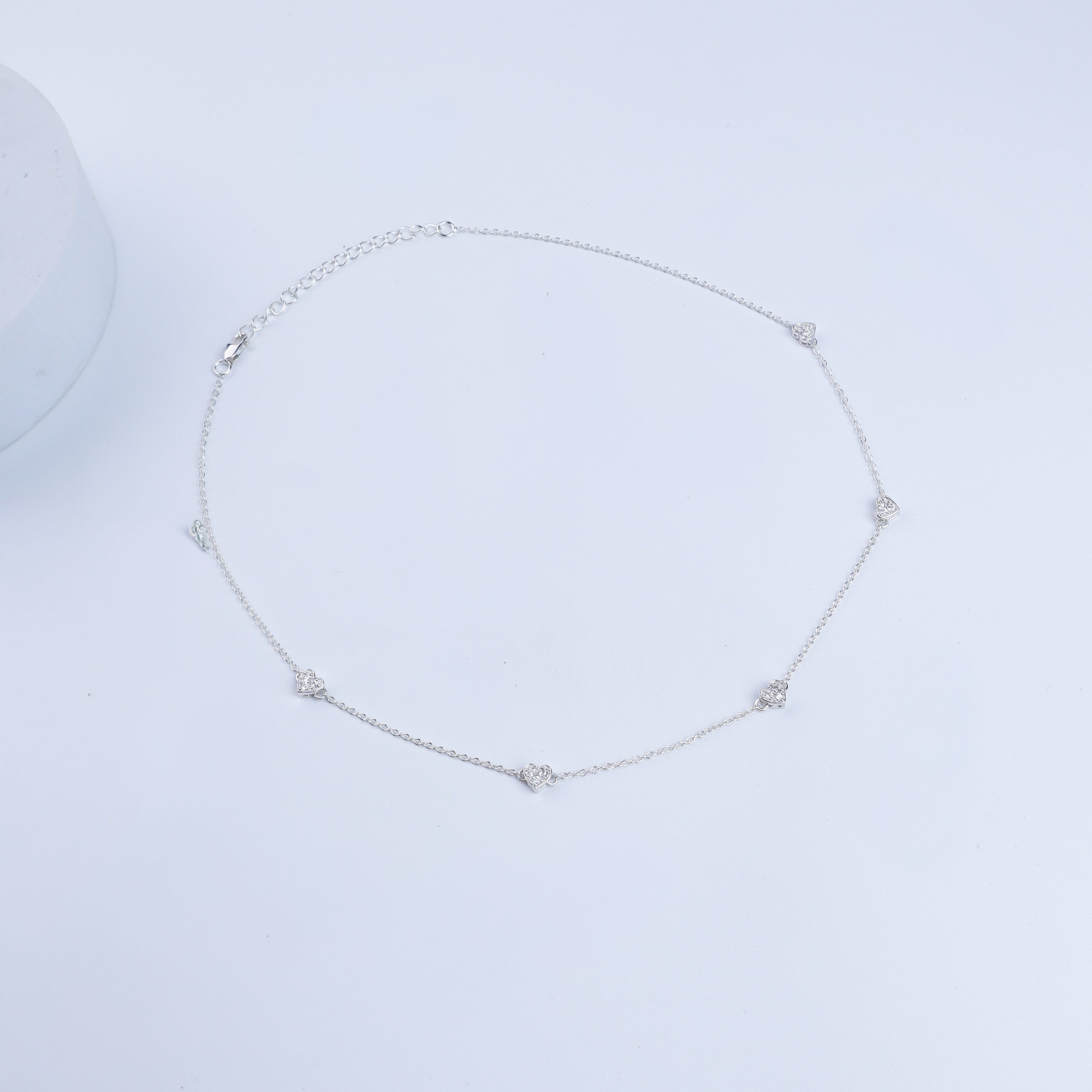 Silver necklace with heart-shaped CZ accents