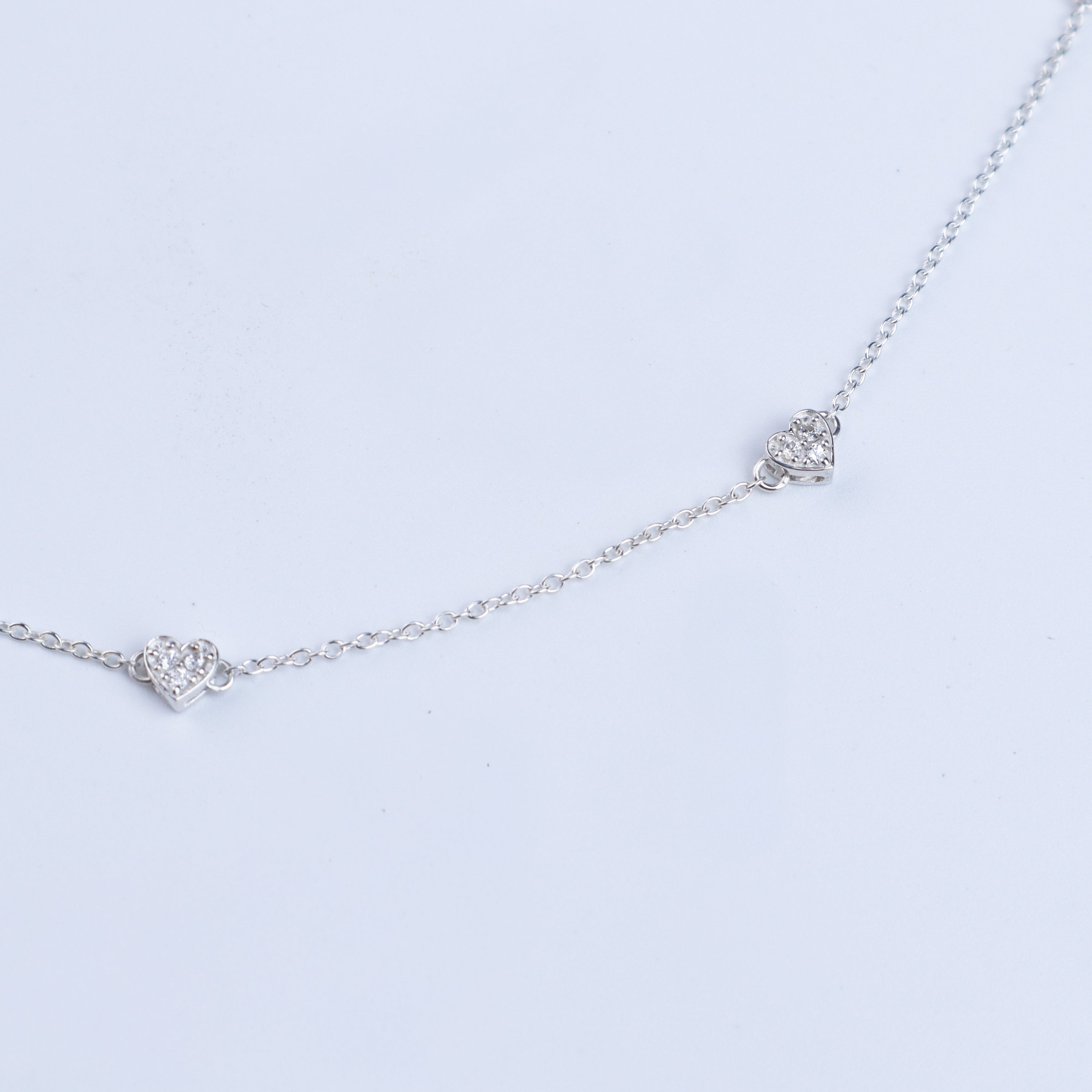 Silver heart necklace with CZ stones