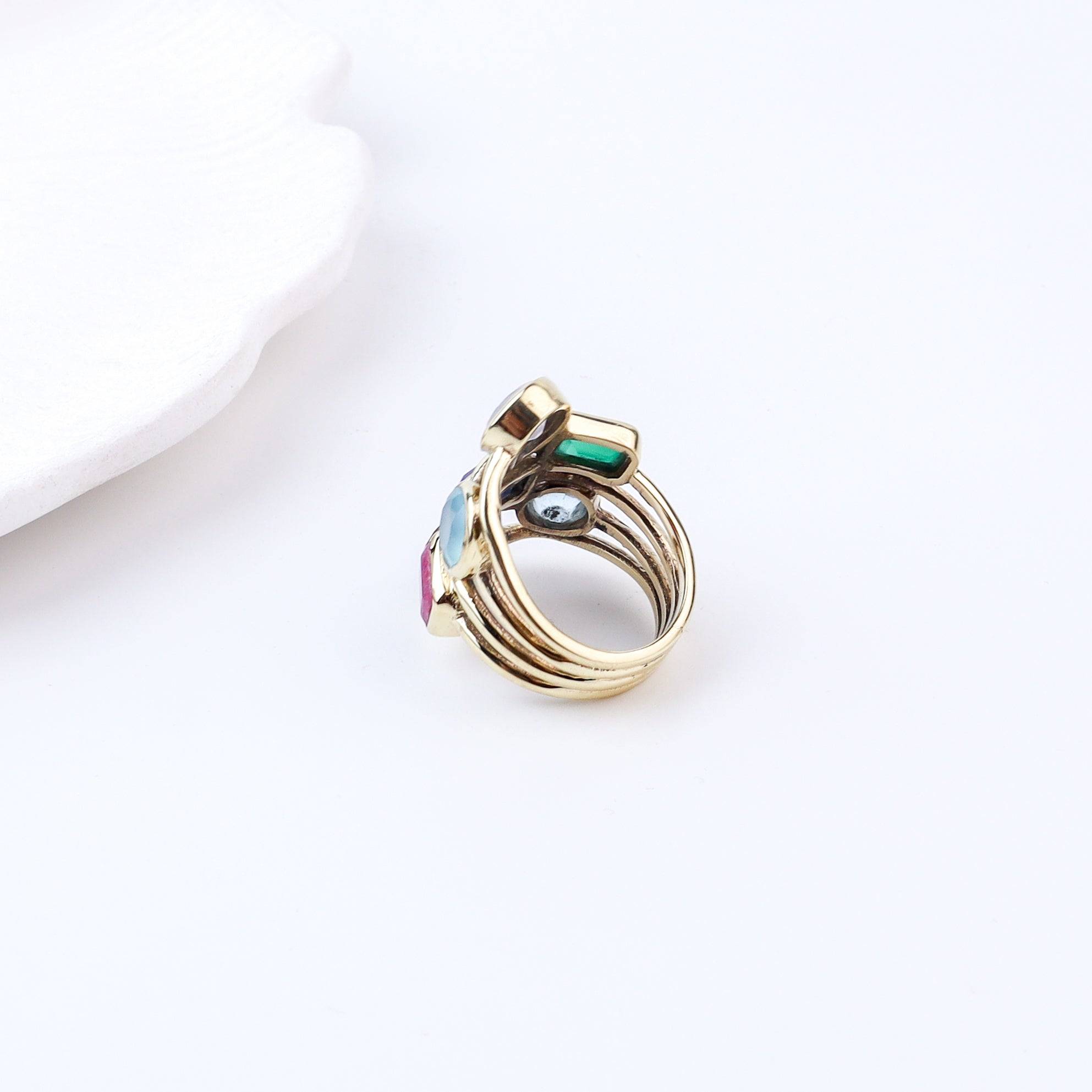 Flat-lay of Brass Fashion Ring with complementary jewellery and accessories for a chic styling setup