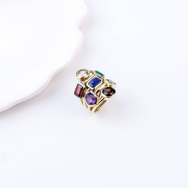 Flat-lay of Brass Fashion Ring with complementary jewellery and accessories for a chic styling setup