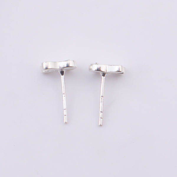 Silver bunny earrings on ear