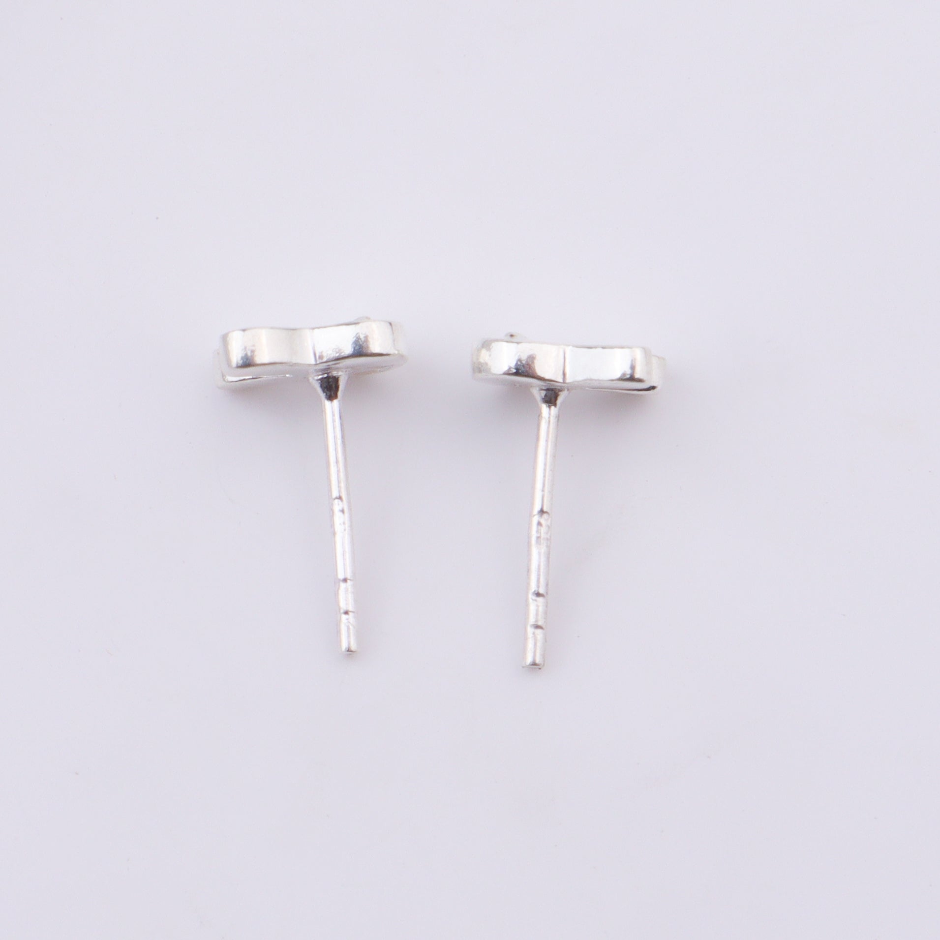 Silver bunny earrings on ear