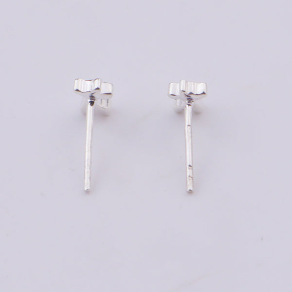 Silver giraffe earrings on white background