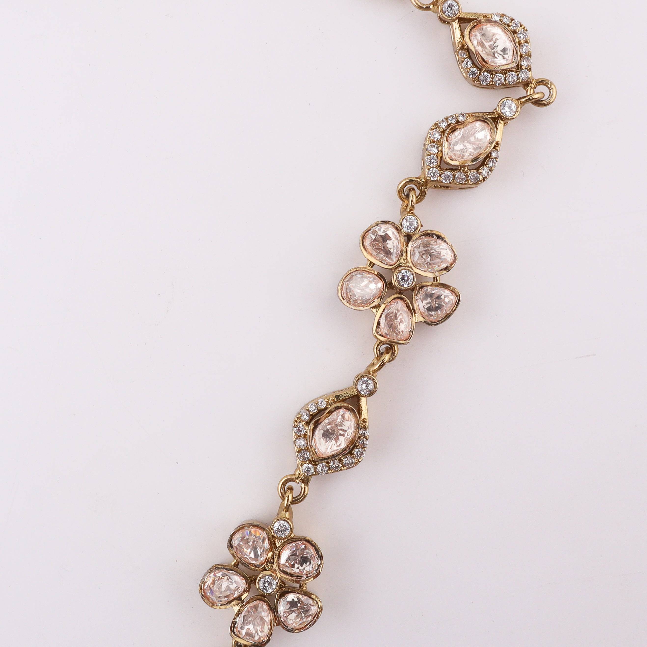 Close-up of a brass fashion necklace showcasing intricate detailing, textured elements, and fine craftsmanship
