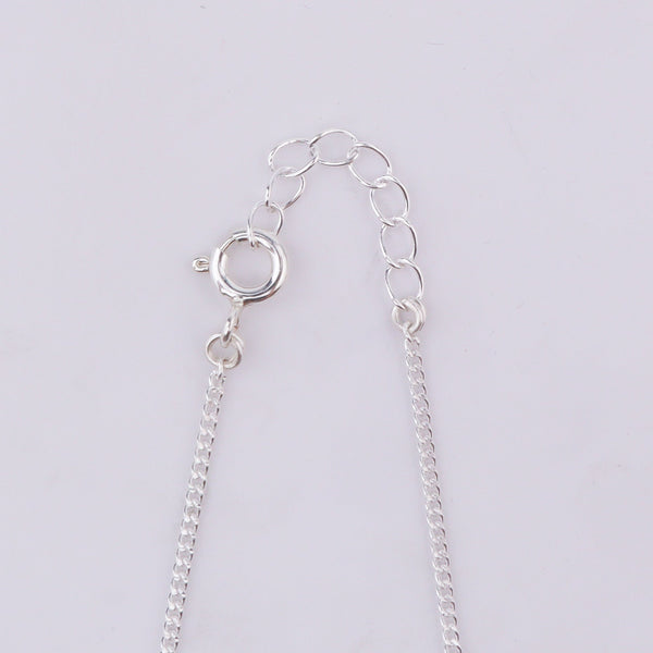 Silver chain with bow pendant clasp detail