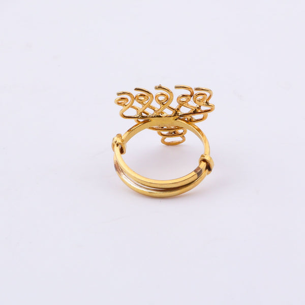 Side view of gold plated Saraswati ring on finger