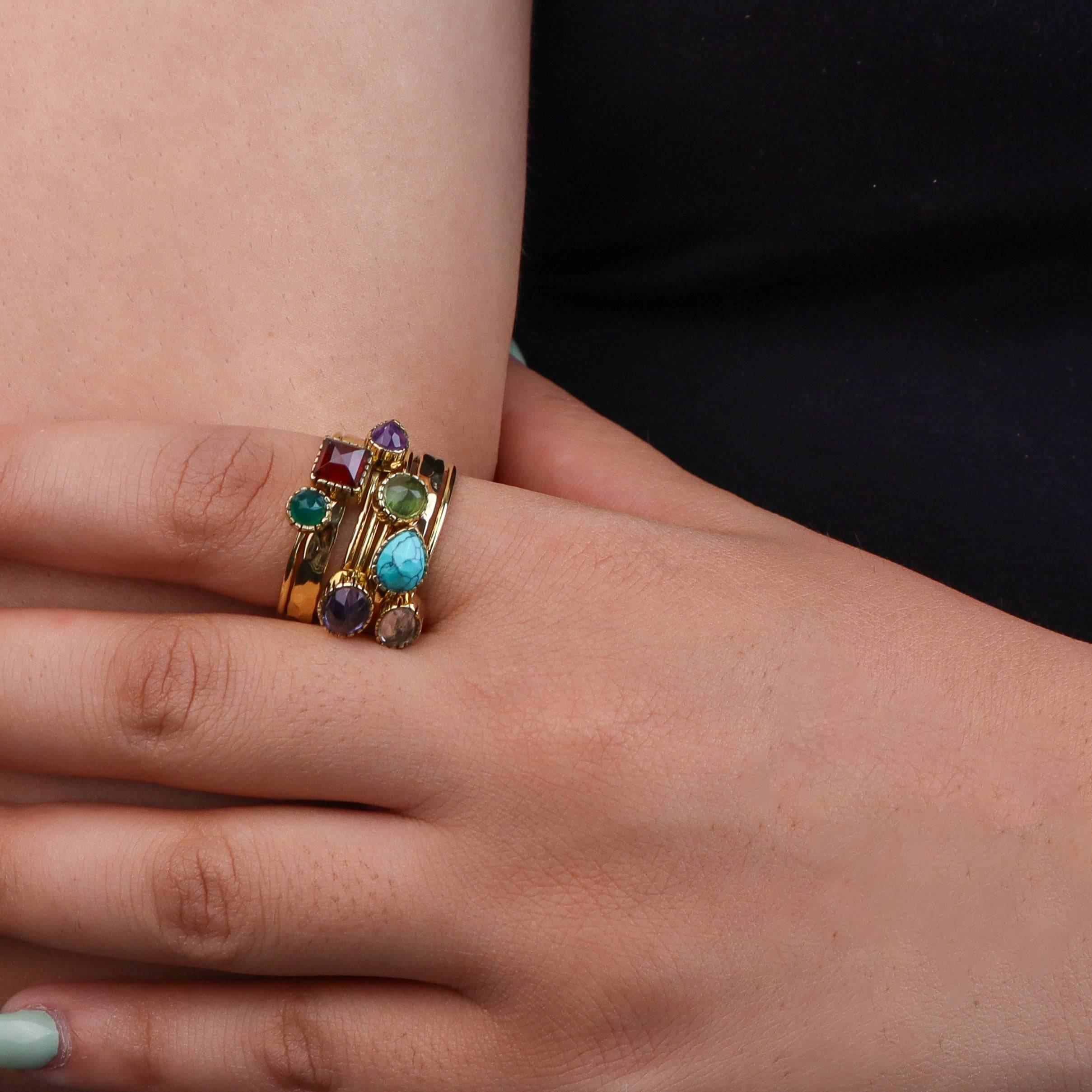 Model wearing a brass fashion ring for a stylish and contemporary fashion jewellery look