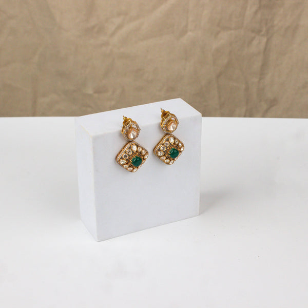 Angled view of 22K gold-plated fashion earring highlighting its elegant silhouette, unique structure, and polished gold finish