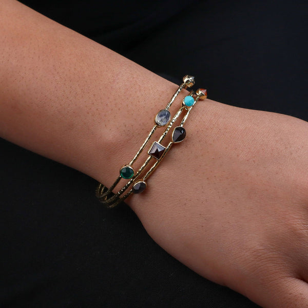 Model wearing a brass fashion bracelet for a stylish and contemporary fashion jewellery look