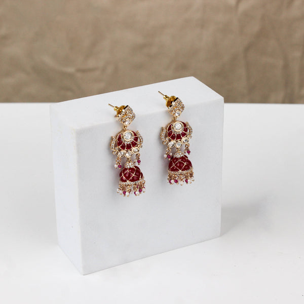 Angled view of a 22K gold-plated fashion earring highlighting its elegant silhouette, structure, and polished gold finish