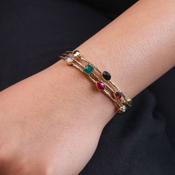 Model wearing a brass fashion bracelet for a stylish and contemporary fashion jewelry look