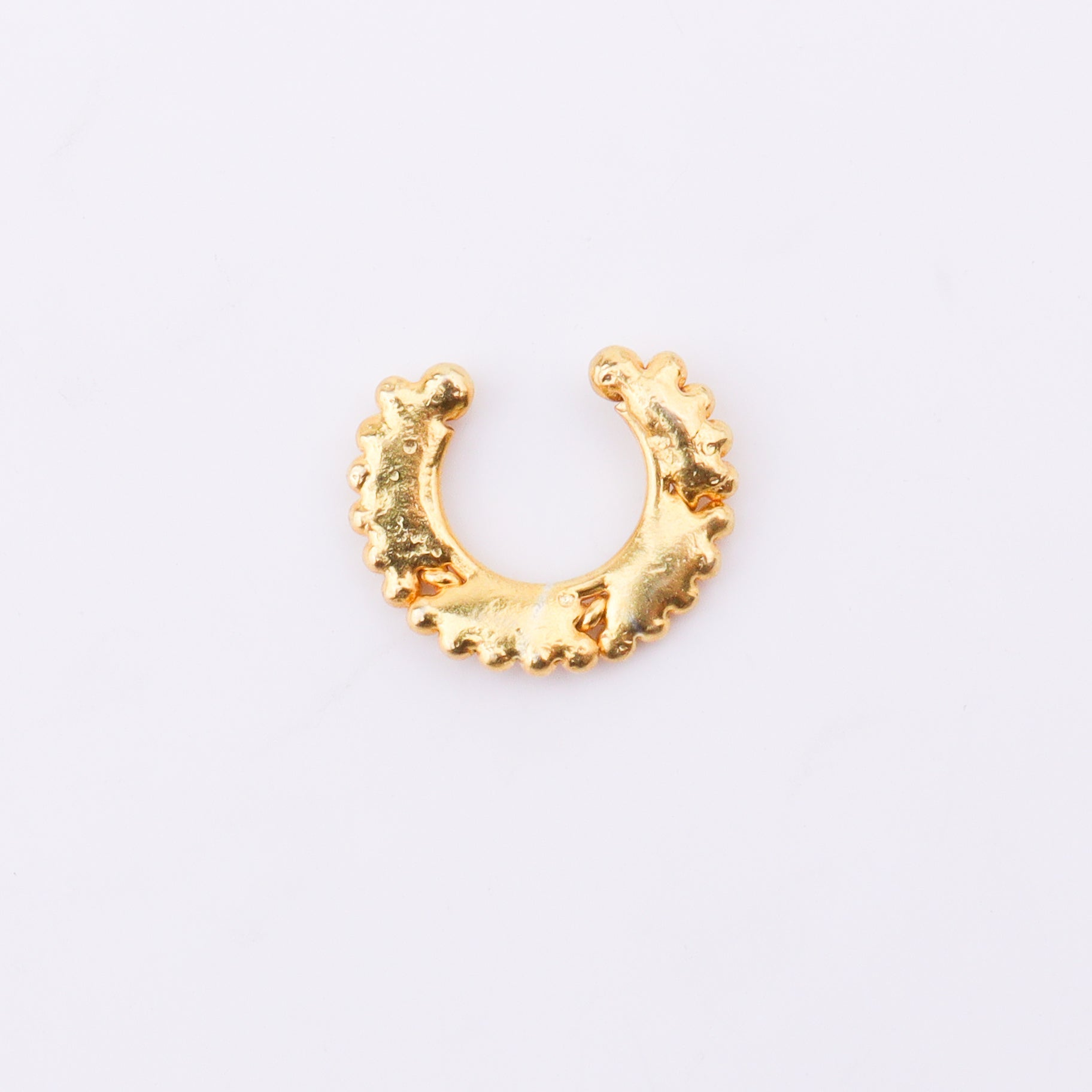Gold septum jewelry on model
