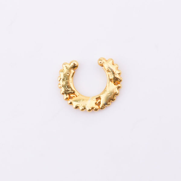 Gold septum jewelry on model