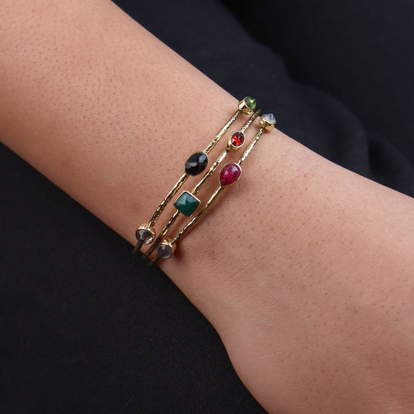 Model wearing a brass fashion bracelet for a stylish and contemporary fashion jewelry look
